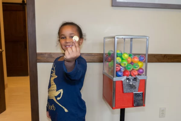 girl with gold coin from machine