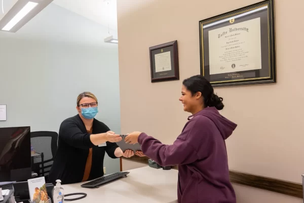 patient with receptionist
