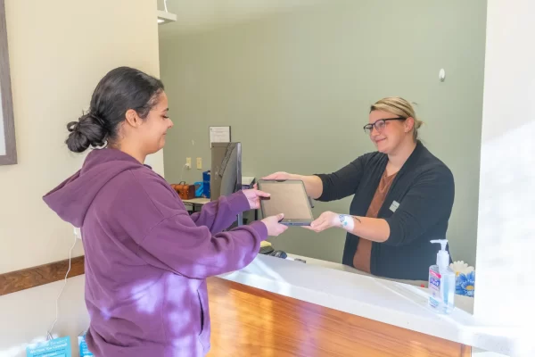 patient with receptionist ipad